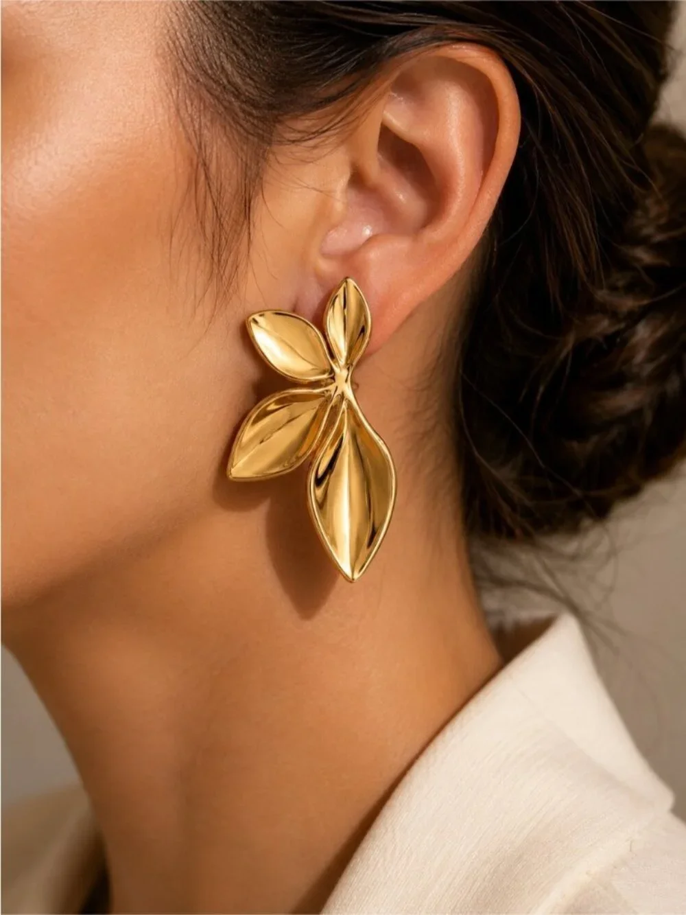 Stainless steel leaves in gold tone stud earrings
